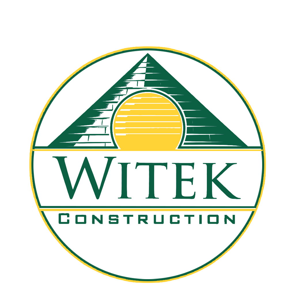 Logo for WITEK Construction featuring a pyramid with a yellow sun rising or setting behind it.