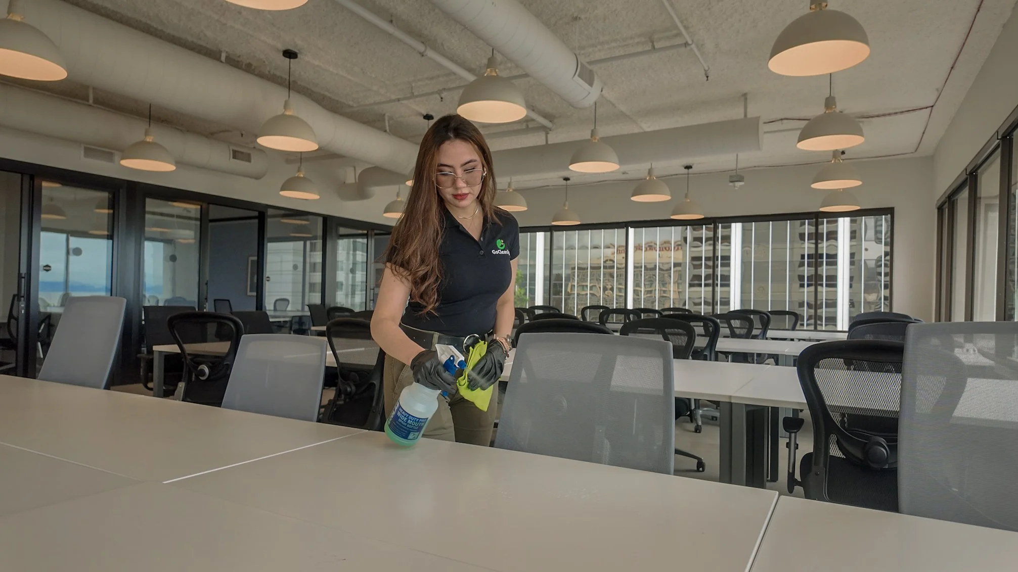 Commercial janitorial service cleaning a conference room in an office in San Francisco, CA