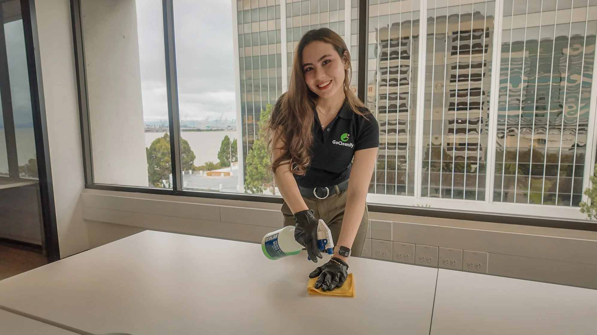 Commercial janitorial service cleaning a conference room in an office in San Francisco, CA