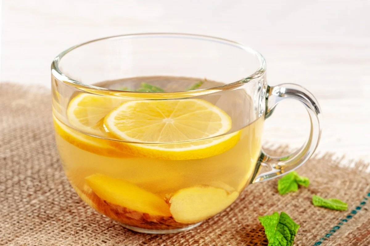 lemon, ginger and mint tea in glass cup