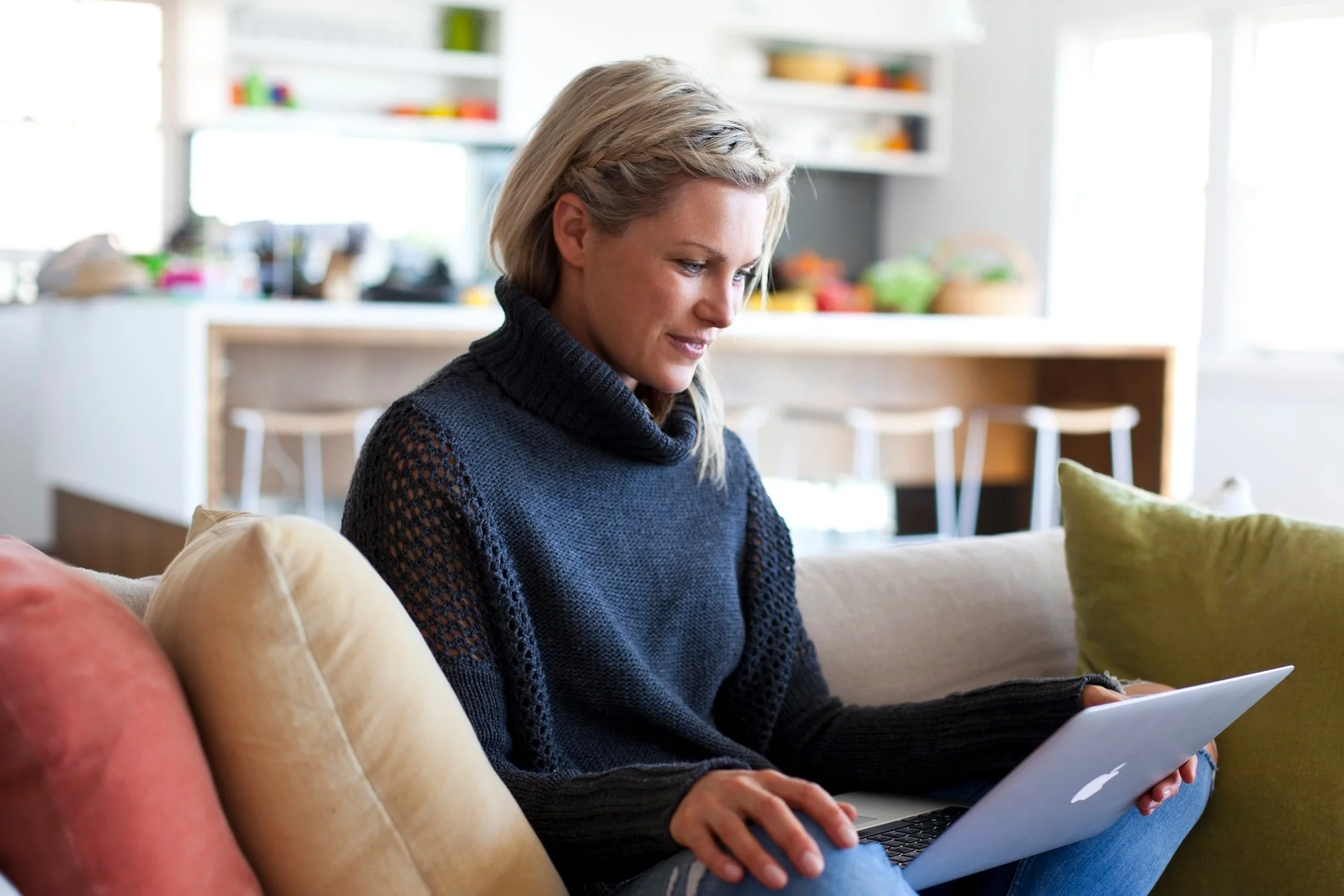 GLP-1 dietitian sitting on coach conducting consult regarding semaglutide diet plan with client