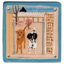 Painting of two dogs, one brown and one black and white, standing on a wooden fence with a blue sky and a tree in the background. To the right, there is a list of years from 1882 to 2006.