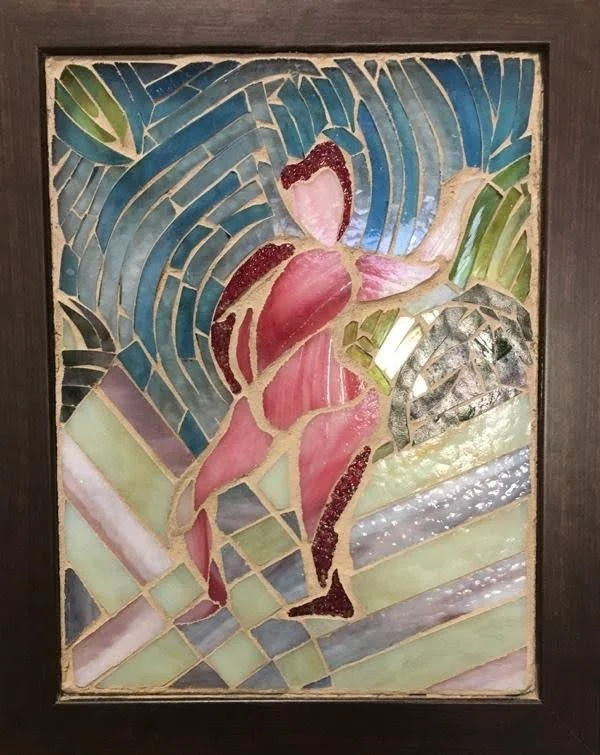 A stained glass artwork depicting a dancing figure with abstract, colorful background and geometric shapes.