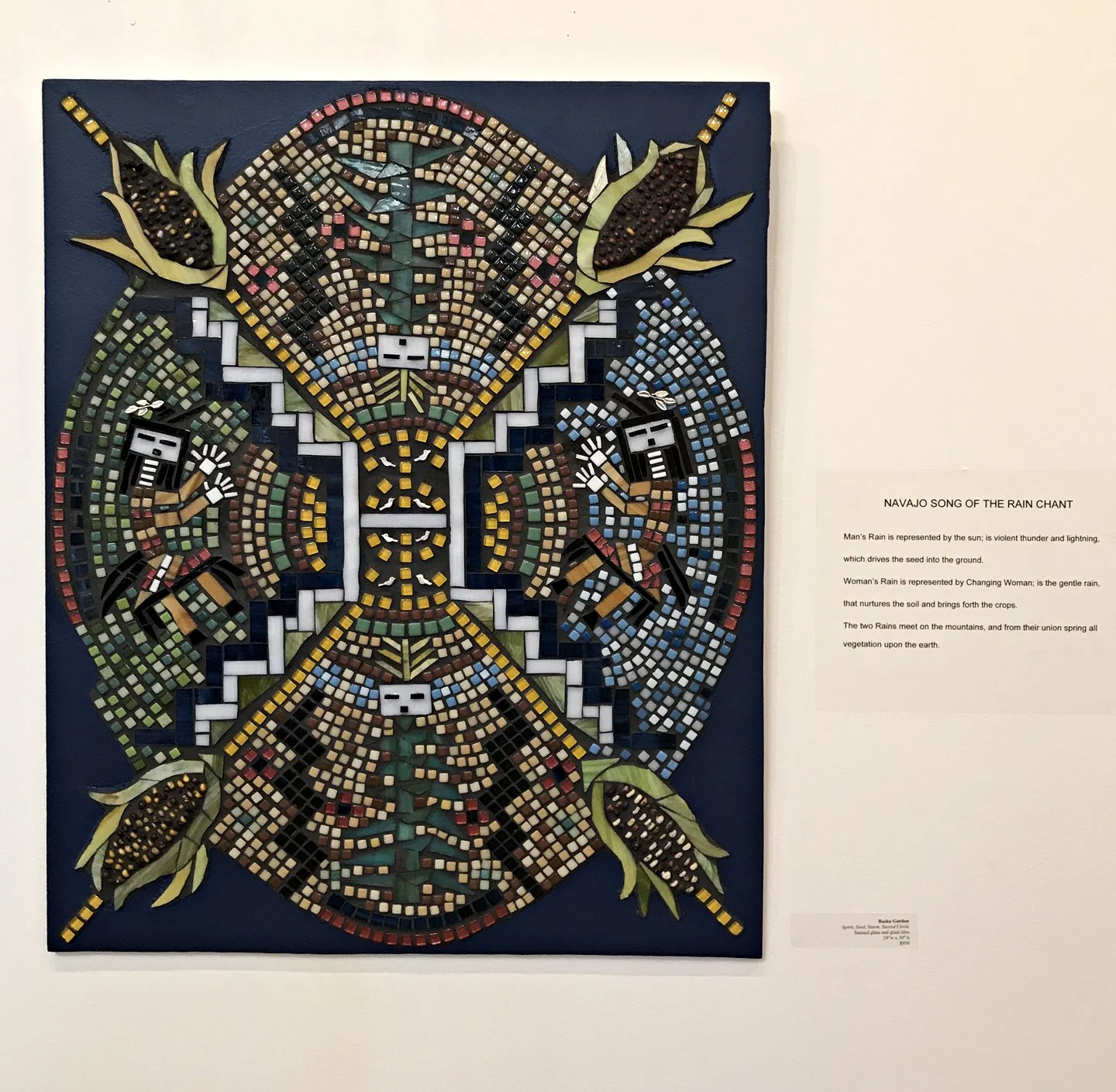 Mosaic artwork titled 'Navajo Song of the Rain Chant' depicting four figures representing rain, with vibrant colors and geometric patterns.
