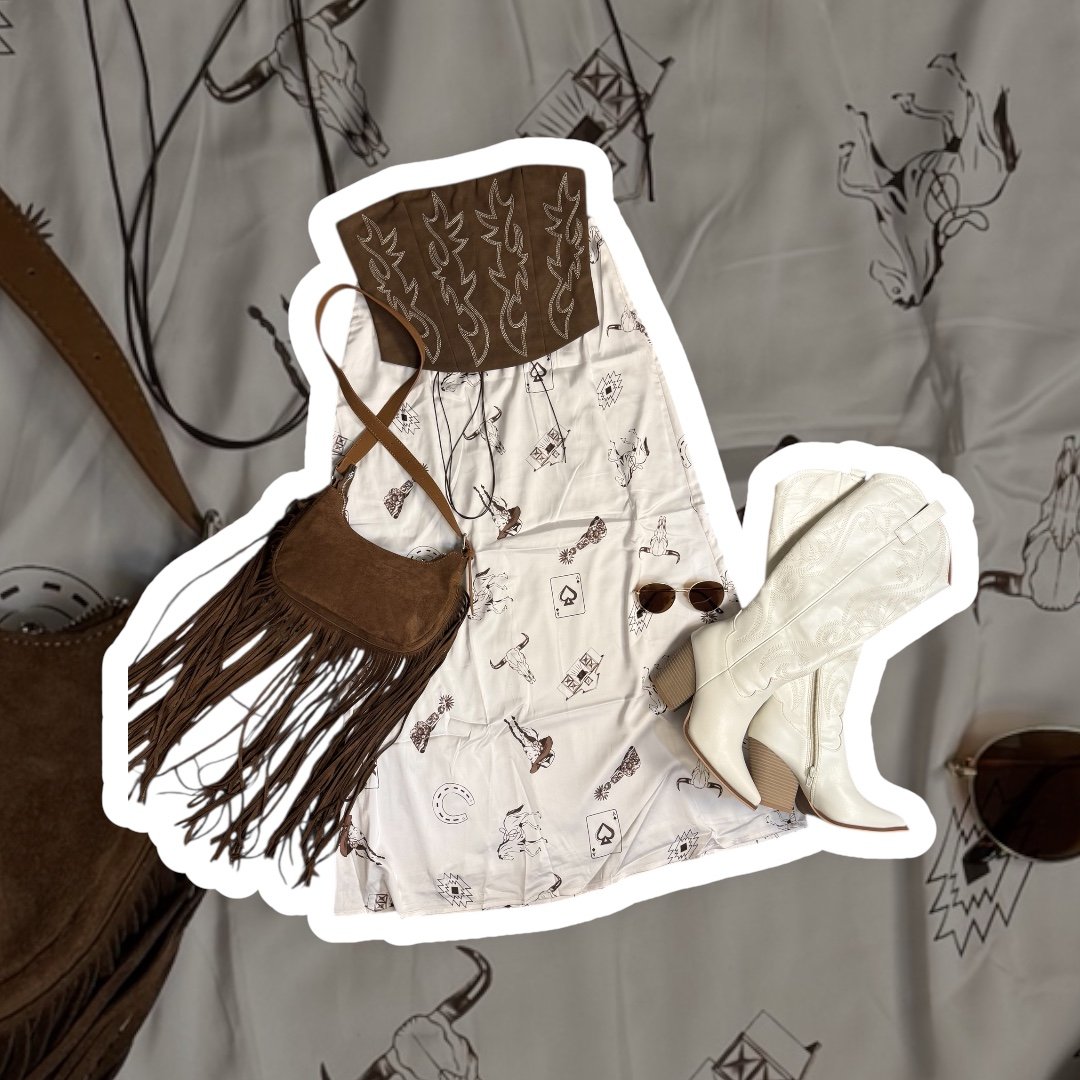 Cowgirl outfit including a white western shirt with black cowboy-themed prints, white cowboy boots, brown fringe bag, brown bandana with white patterns, and sunglasses.