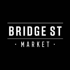 Sign for Bridge Street Market with black background and white text.