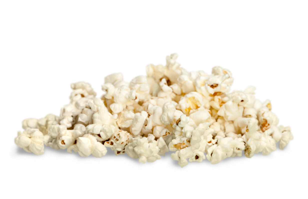 A pile of buttered popcorn on a black background.