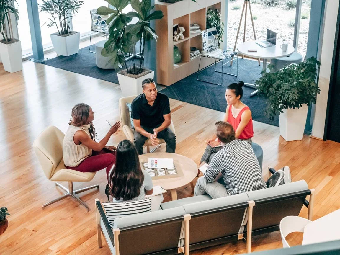 nonprofit team having meeting in office space.