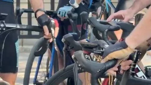Cyclists’ hands on handlebars in CBS Colorado’s Spoke cycling story.