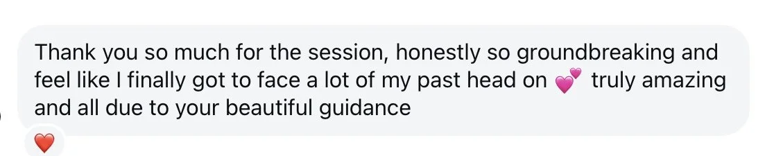 Screenshot of a text message expressing gratitude for a session that helped the sender face their past with guidance, including heart and pink heart emojis.
