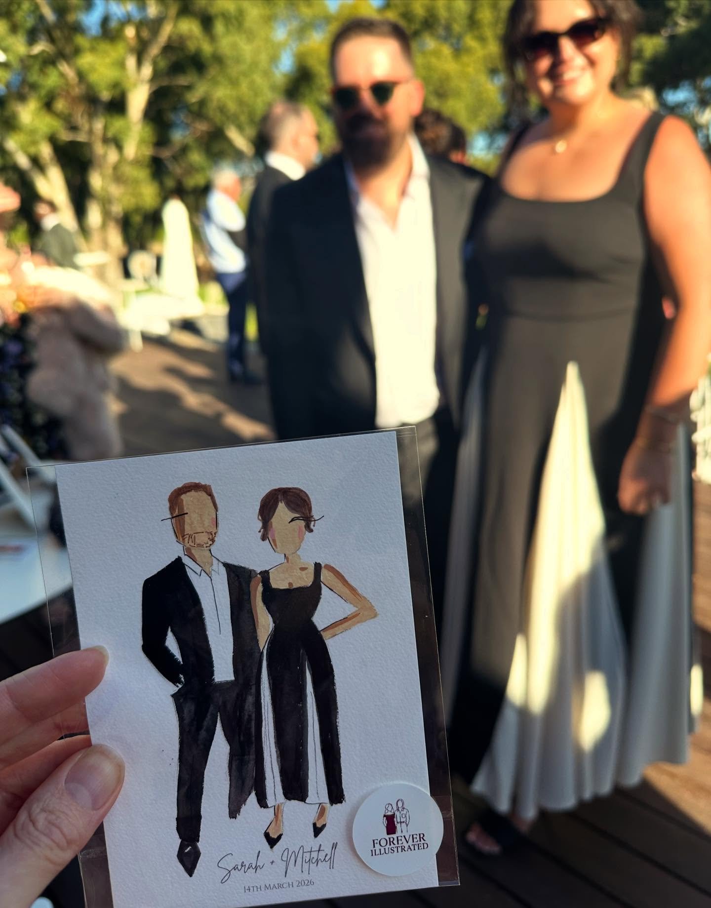 A cute live guest portrait caught on camera!

What are Live Guest Illustrations?

- Your guests have their photo taken
- Your guests go and celebrate the night away
- Your guests come pick up their hand painted portrait before leaving 

Such a beauti