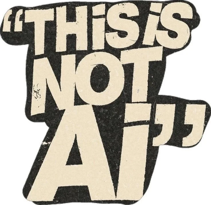 Typography artwork with the quote "This is not a AI" in bold, black and white block letters.