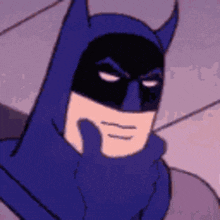 Close-up of Batman with a serious expression, wearing his traditional dark costume and cowl.