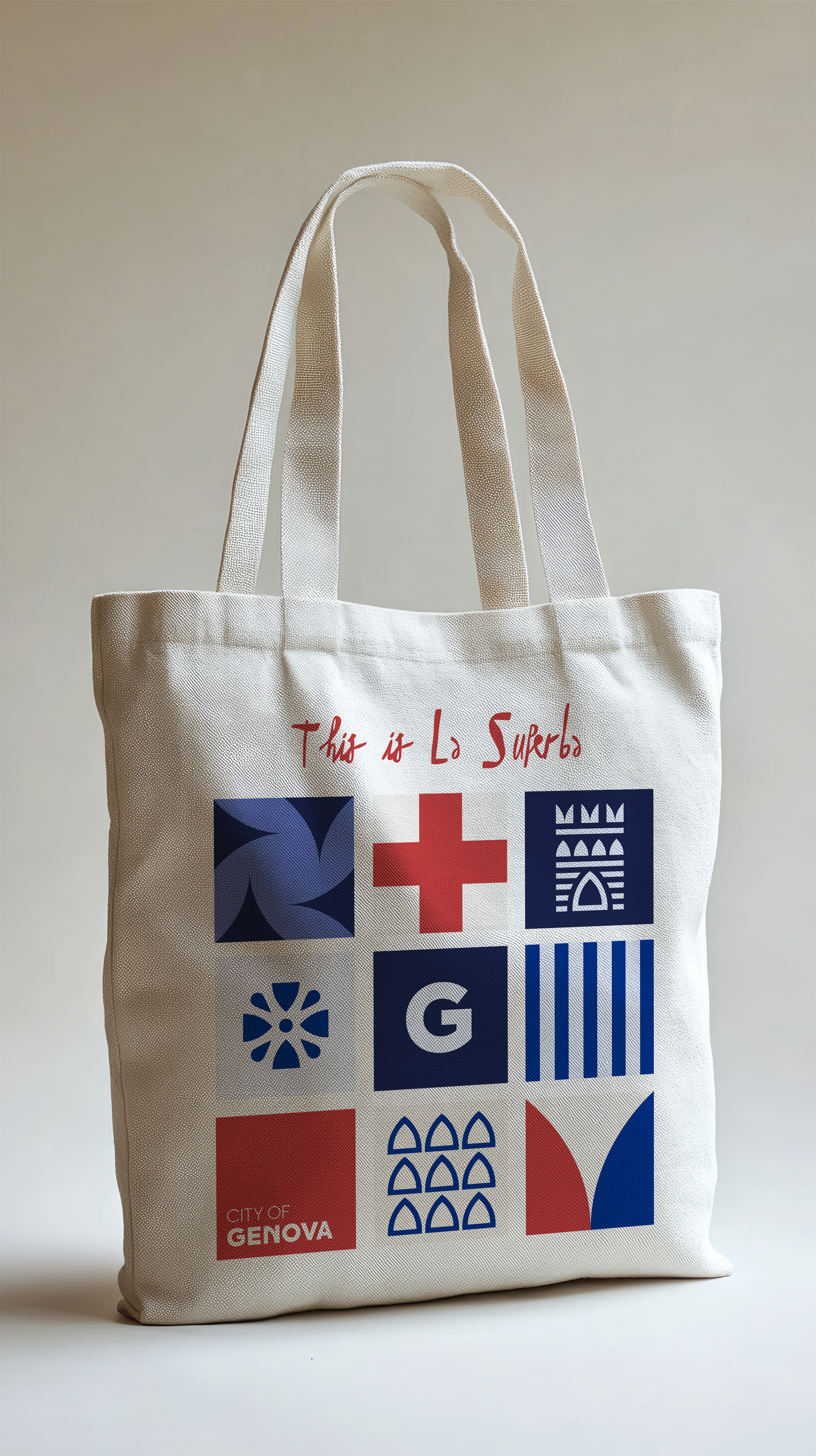A beige tote bag with colorful graphic symbols and text that says 'This is La Superba'. The symbols include geometric shapes, a red cross, cityscape icons, and stripes, with a label indicating it is from the city of Genoa.
