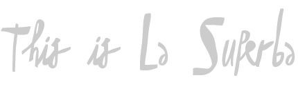 A handwritten phrase that says, 'This is La Surba' in gray text on a black background.