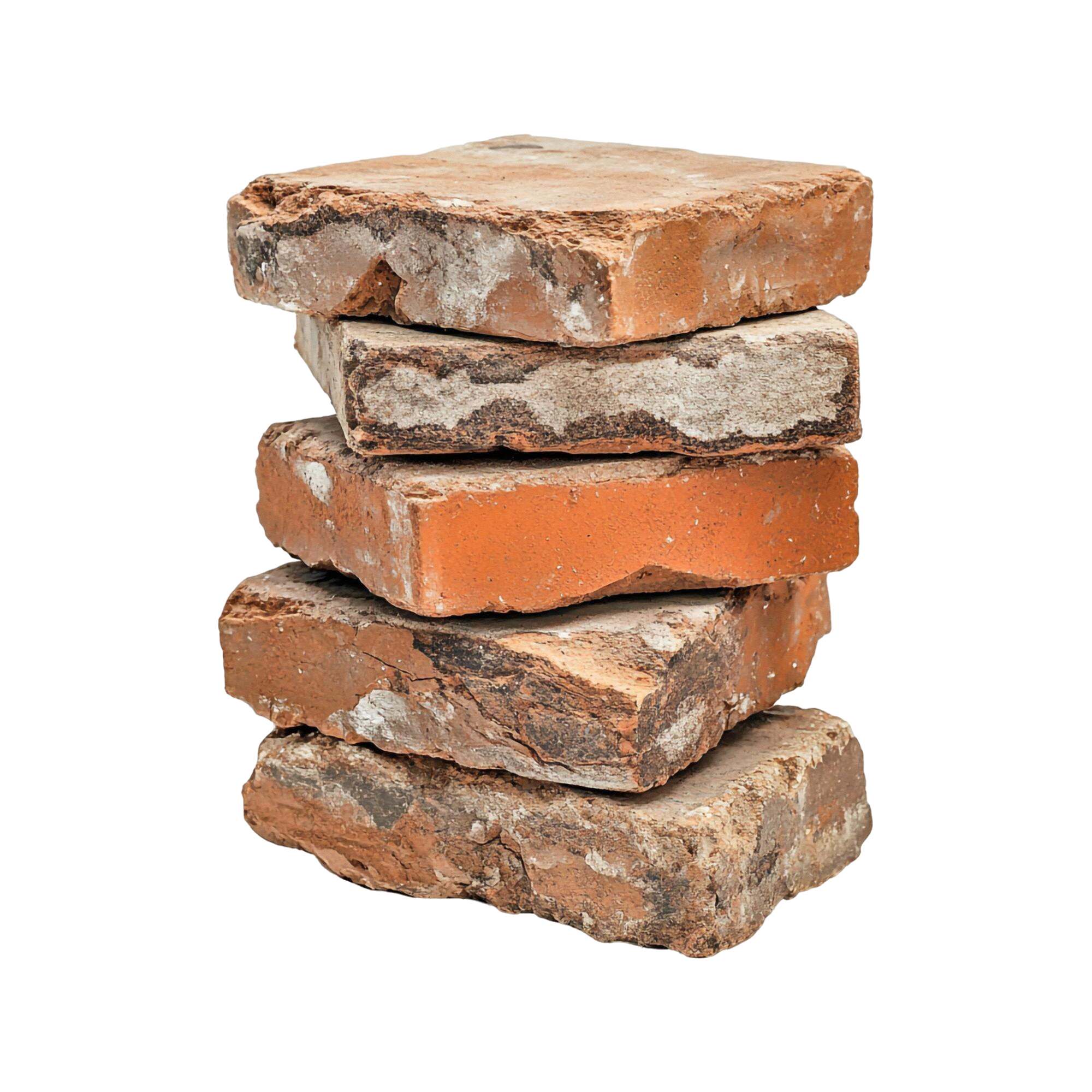 Close-up view of a stack of irregularly shaped, weathered bricks with chipped edges and a rough surface.