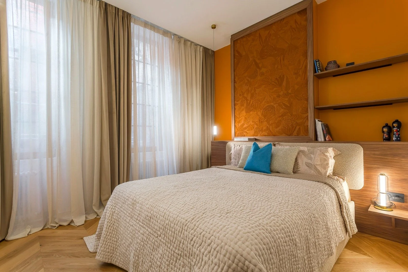 Sheer linen curtains and blackout velvet drapes in a French bedroom
