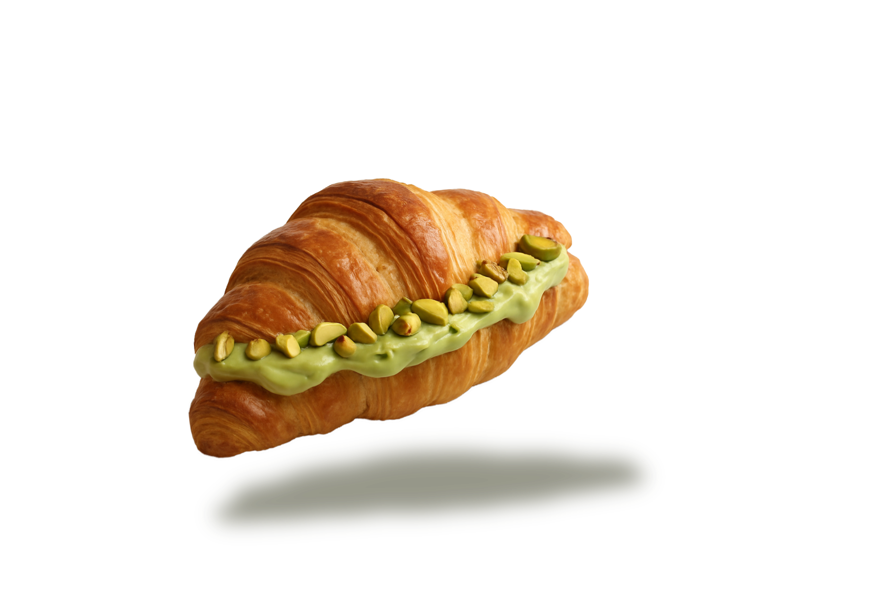 Nutchio creamy pistachio butter spread on a flaky croissant — rich, smooth, and made from 100% real pistachios