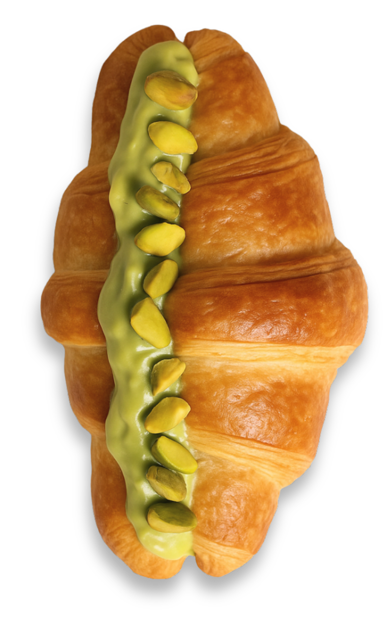 Flaky croissant generously spread with creamy Nutchio pistachio butter for a delicious breakfast treat