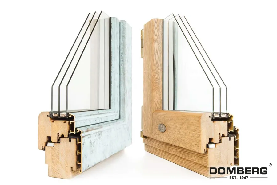 Cross-section of two window frames, one metal and one wood, showing the internal structure and insulation details, with the Dombre brand logo at the bottom right.
