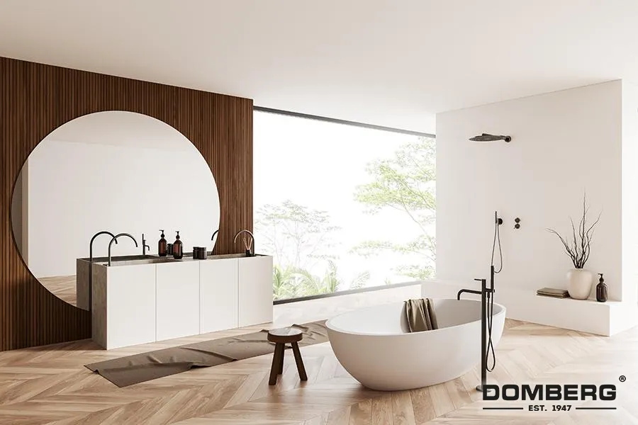 Modern bathroom with a freestanding bathtub, wooden stool, large window with natural light, and minimalist decor including vases and plants.