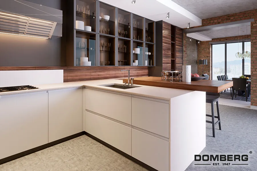 Modern kitchen with white cabinets, wooden countertop, open shelving with glassware and dishes, brick wall, large window with city view, and dining area in the background.