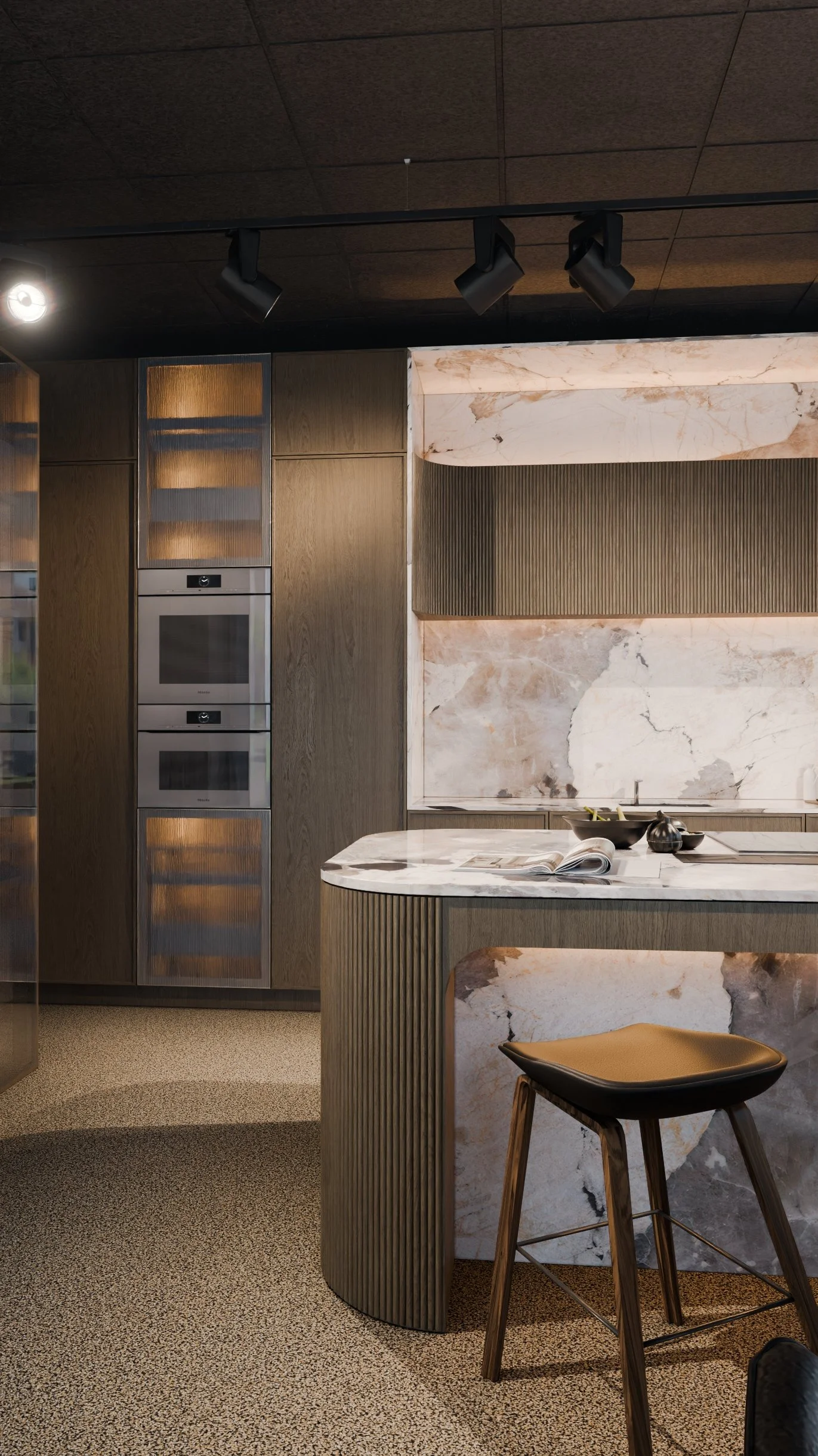 Modern kitchen with wood and marble accents, built-in ovens, marble countertop, and barstool.