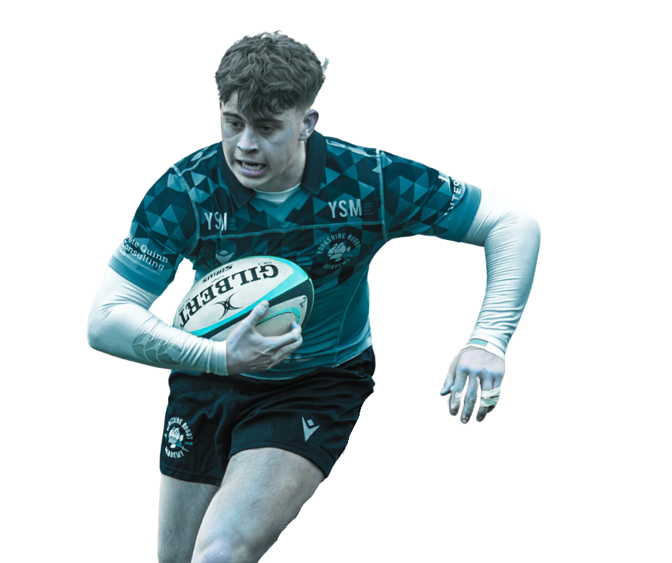 A rugby player carrying a rugby ball during a game, wearing a blue and black jersey and black shorts.