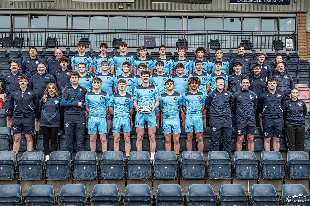 Full player and staff team picture in stadium stand