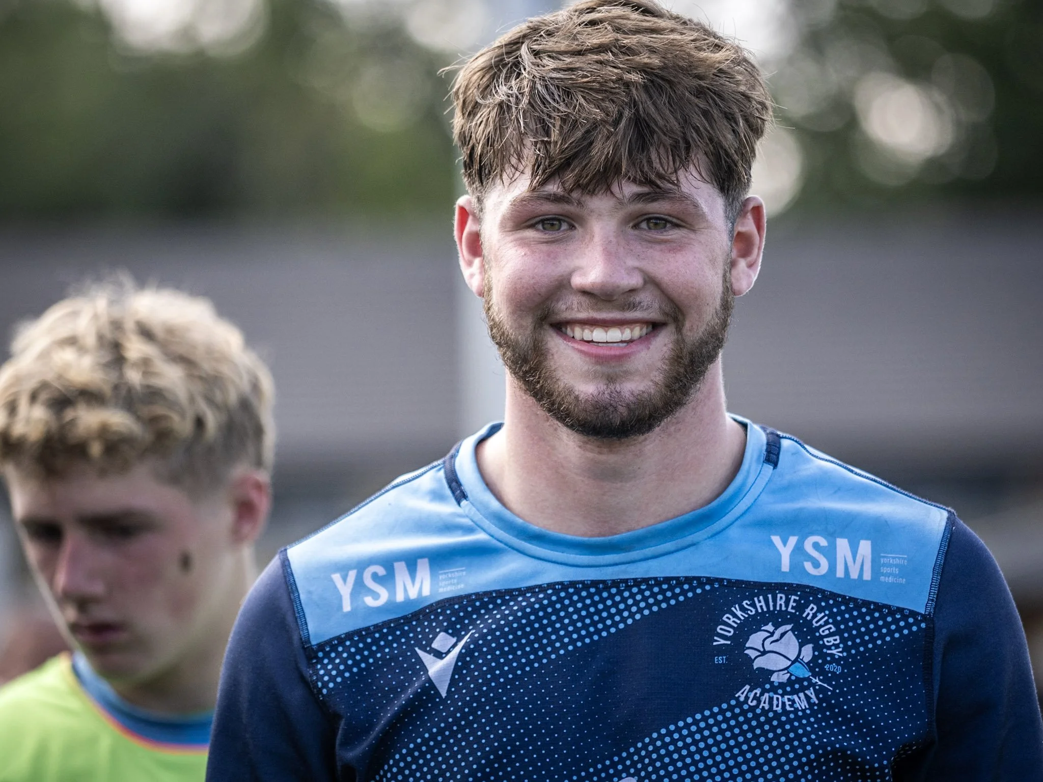 Lewis Jalal smiling at camera