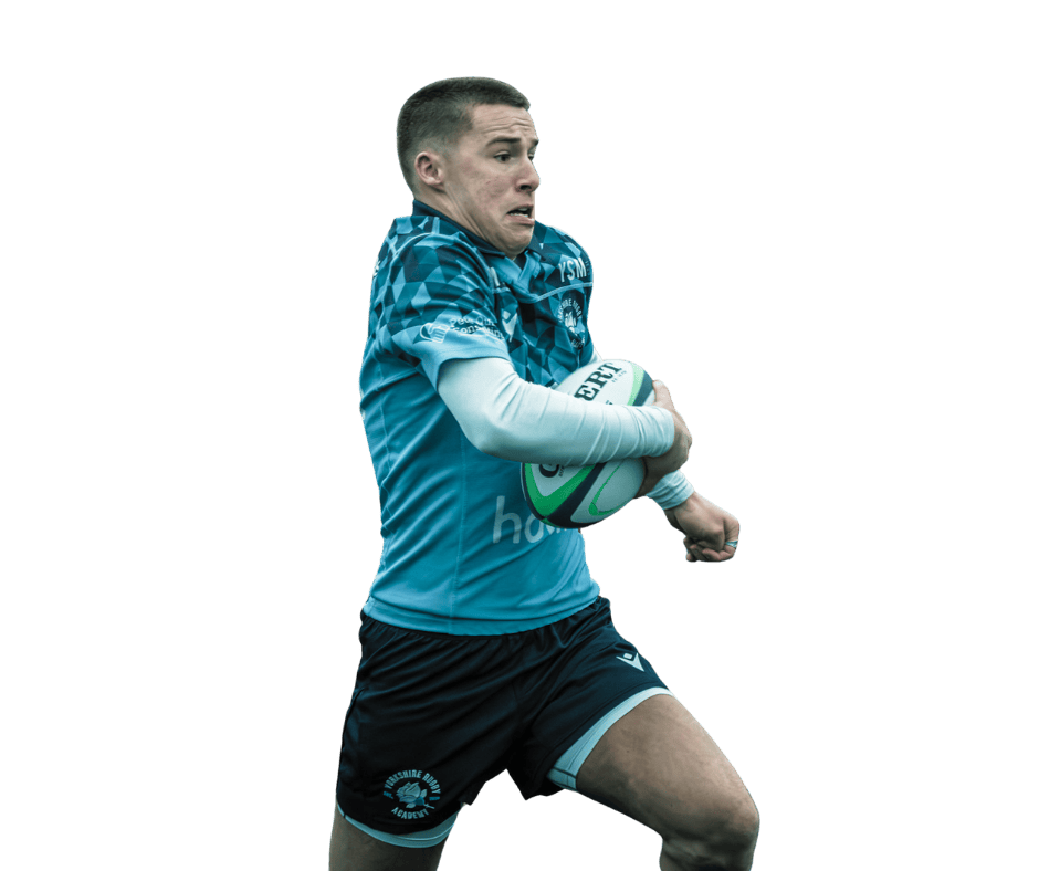 A rugby player holding a ball during a game, wearing a blue jersey and black shorts.