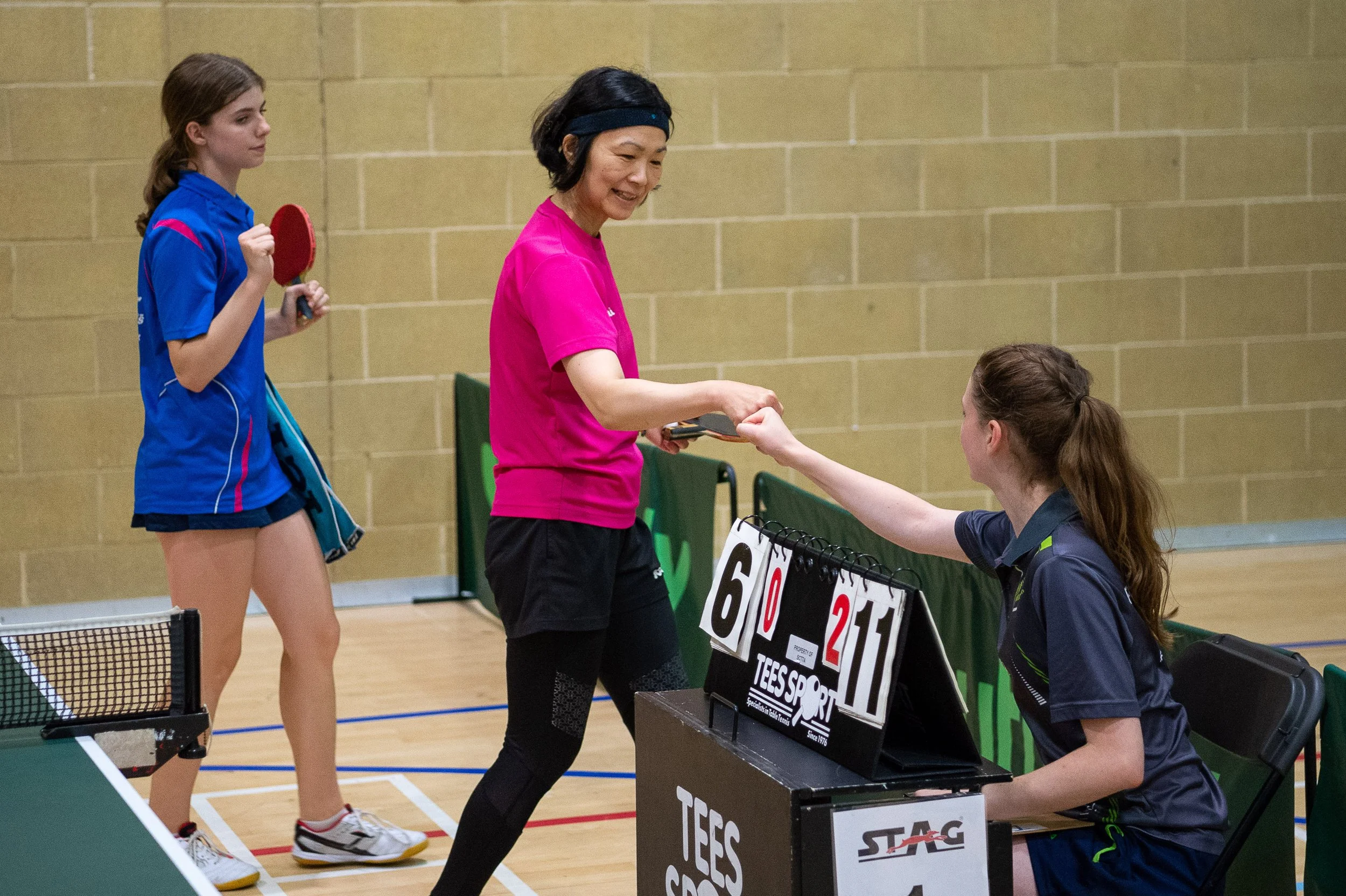 Player female players with umpire handshake 001.jpg