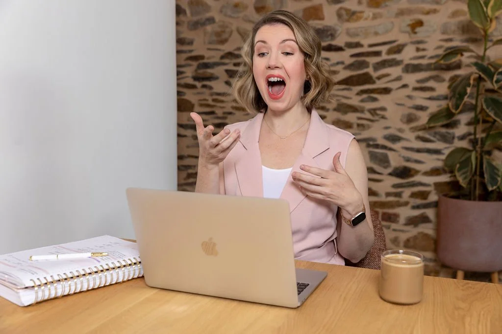 Speech Pathologist conducting a voice therapy via telehealth on a laptop