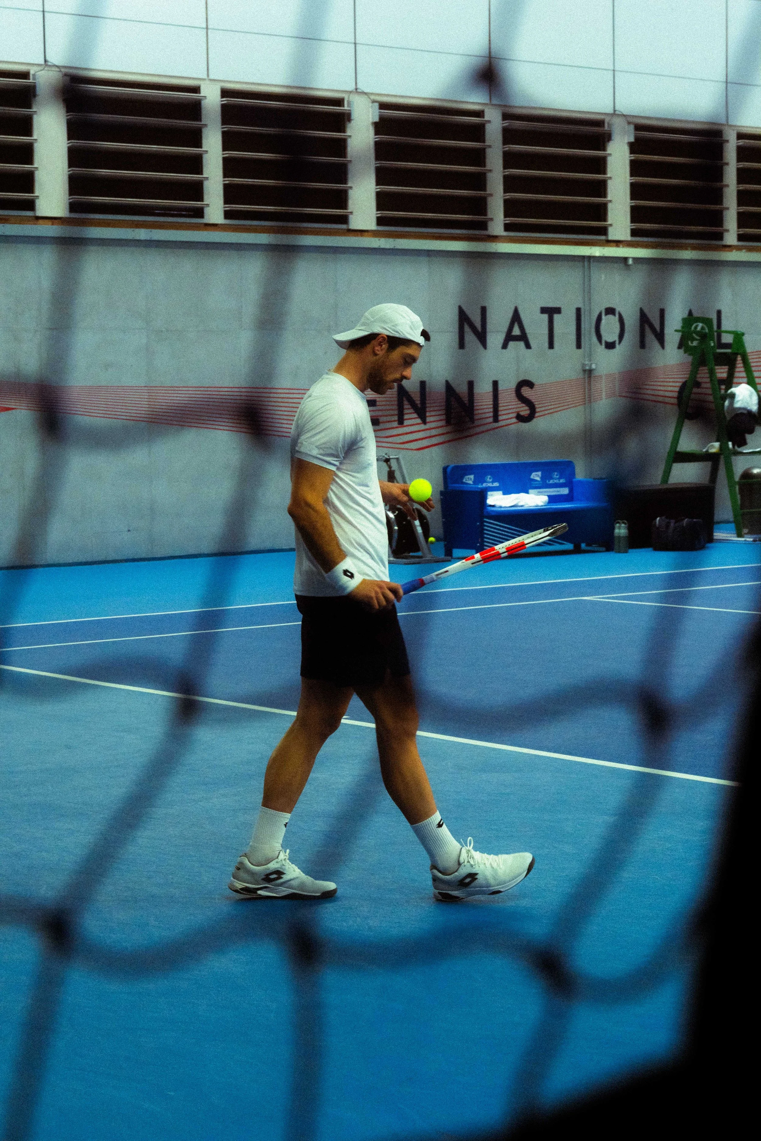 Tennis player through the net