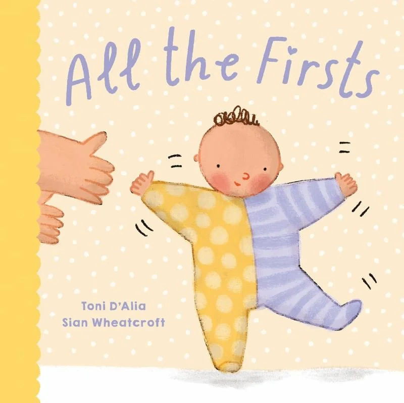 Cover of children's book titled 'All the Firsts' showing a baby with arms wide open, balancing between two adult hands, with a background of white polka dots and a yellow border.