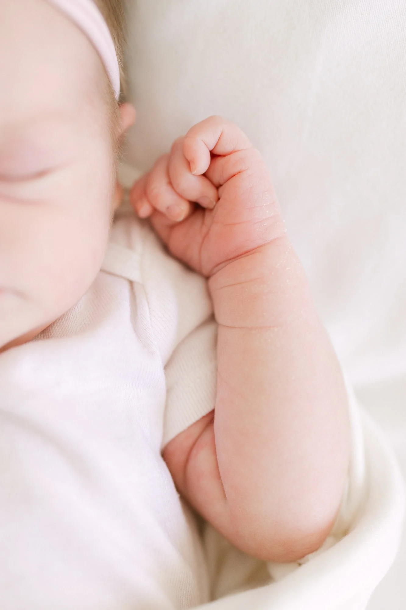 closeup detail image of a newborn baby girl's hand during an in home newborn session by Christi Lynn Photography in Arlington Heights