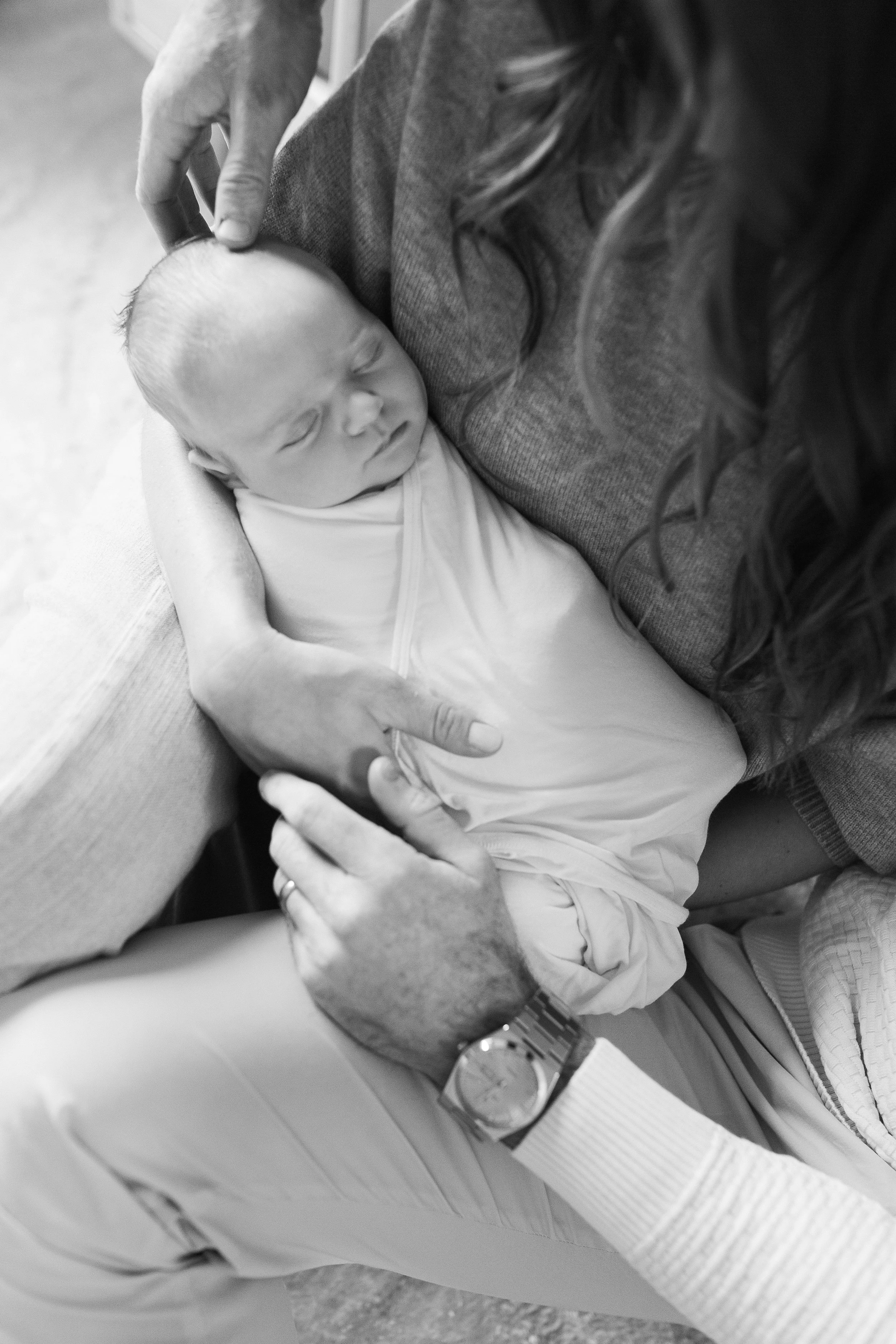 detail photo of newborn hands taken by Christi Lynn Photography during an in-home session in Arlington Heights