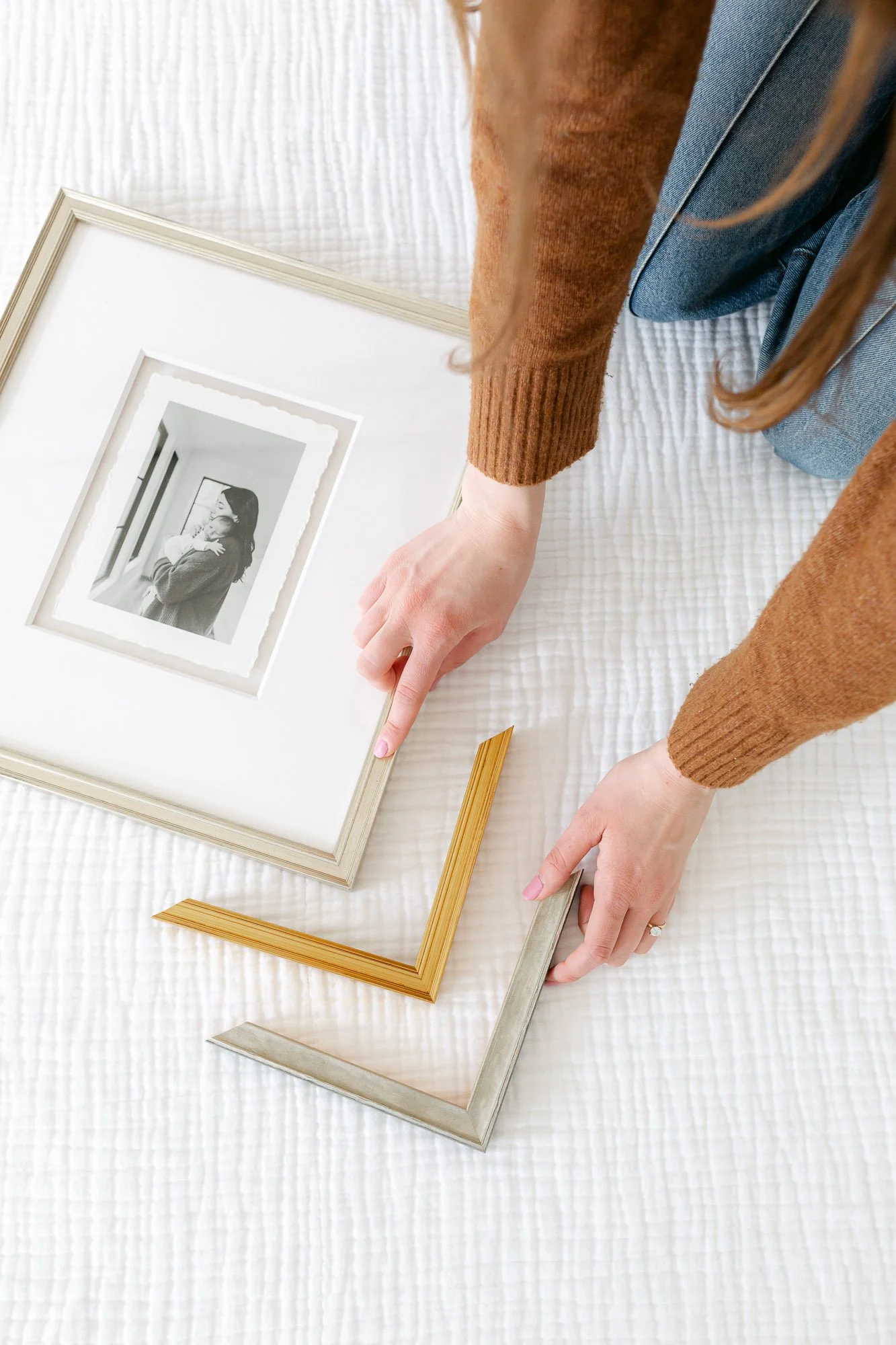 framed photo of mom holding newborn baby and other framing corners samples