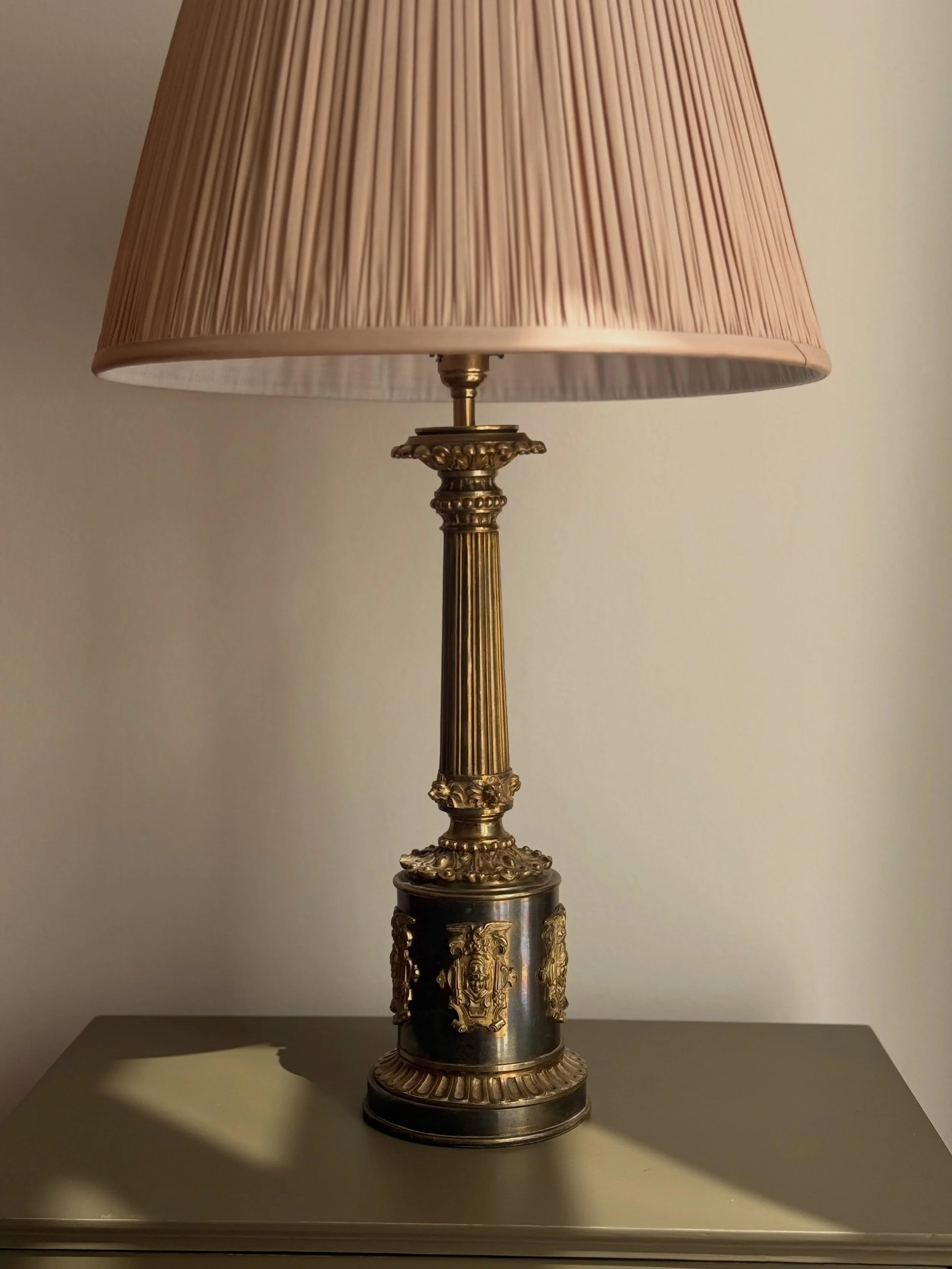 An unusual 20th-century Empire-style table lamp, with richly detailed gilt mounts and an elegant fluted column.

A wonderfully decorative statement piece, standing approximately 48 cm tall.

Available now &mdash; dm for details, soon on the website.
