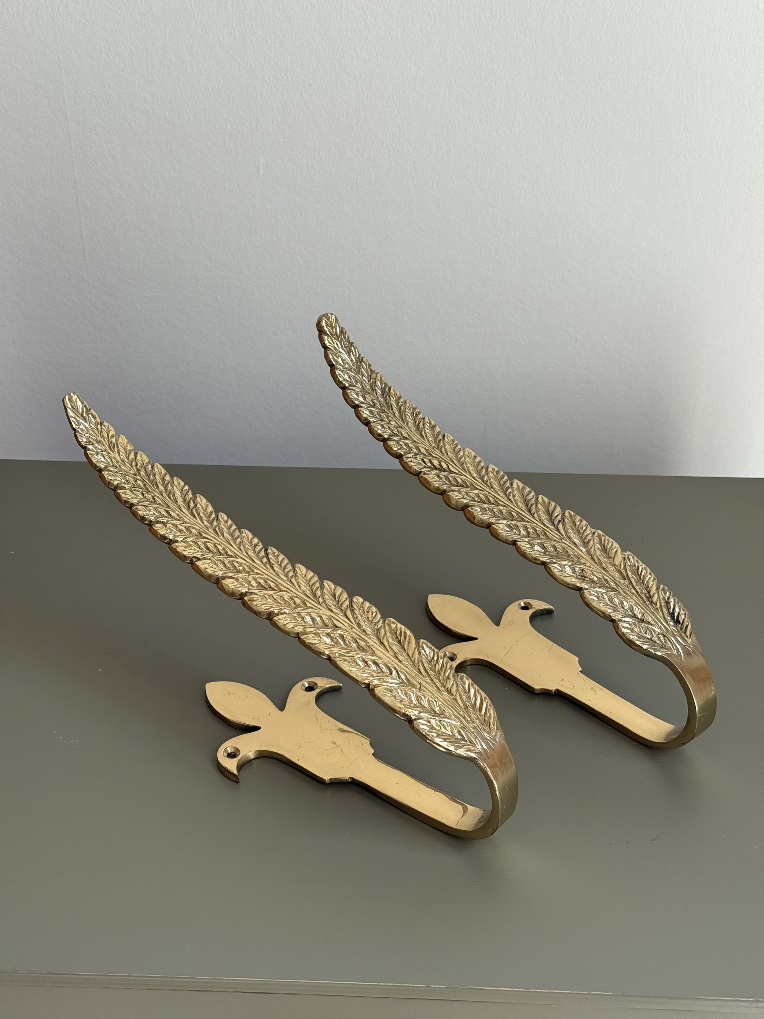A Pair Of Large Brass Curtain Hooks