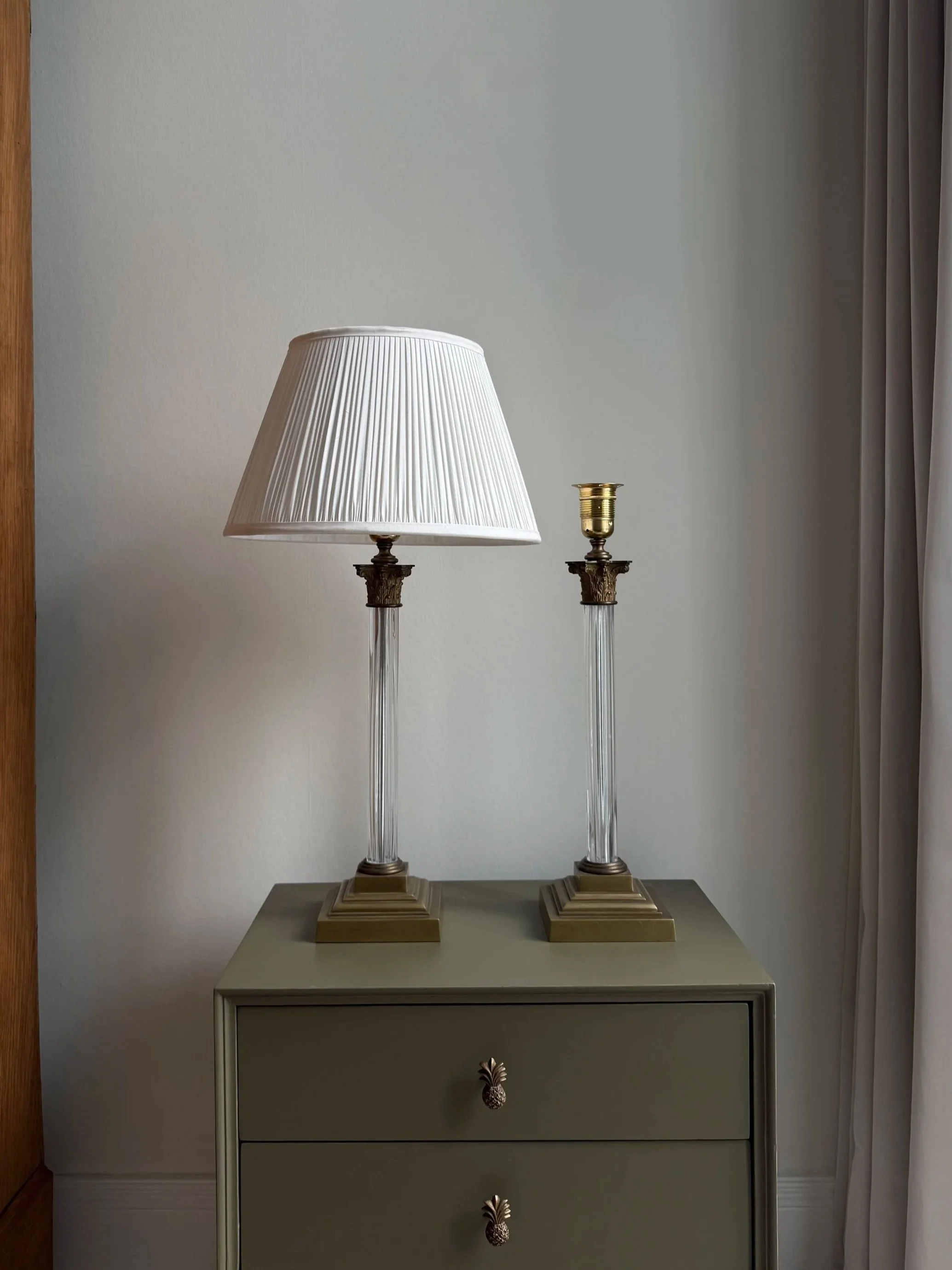 A Pair Of Corinthian Glass Lamps