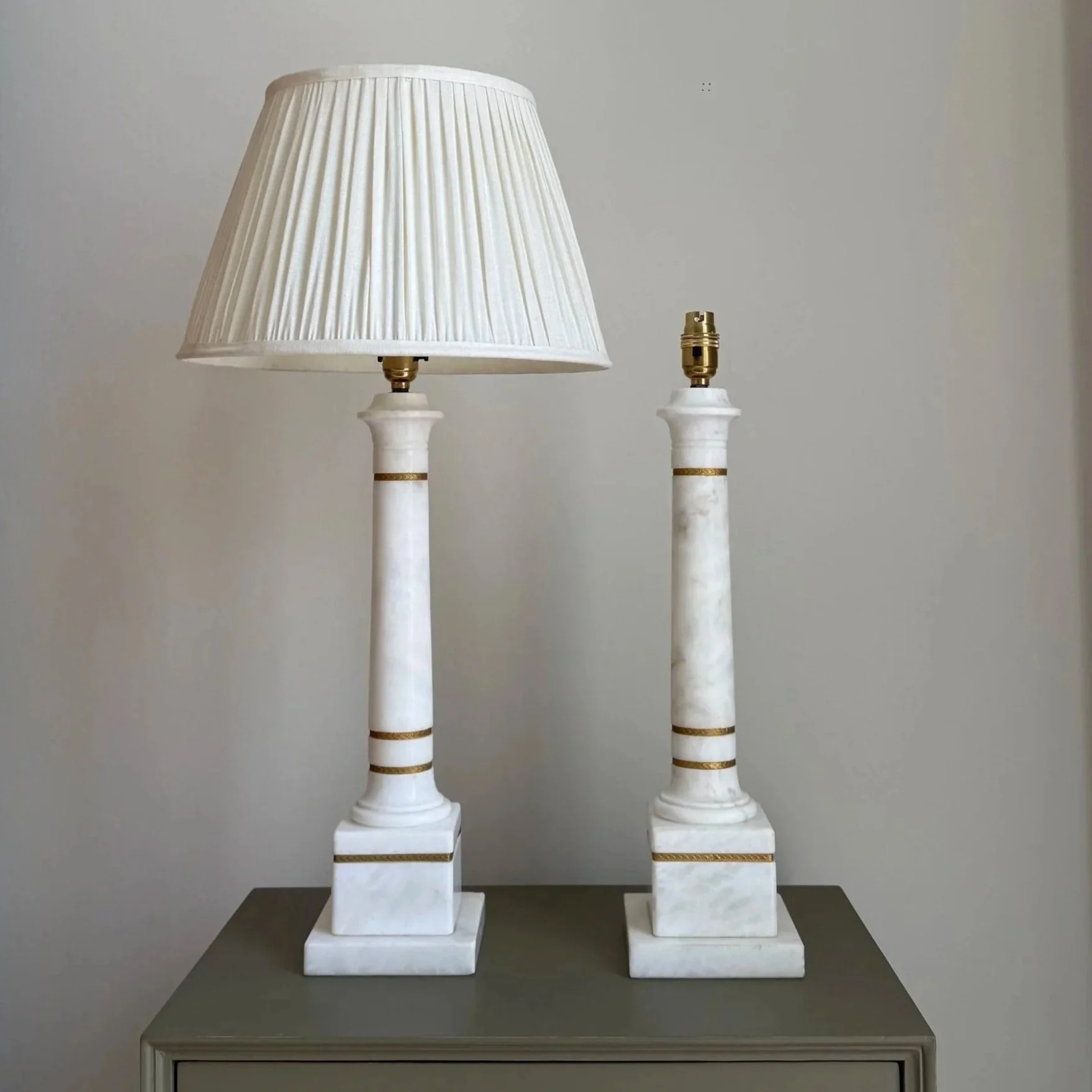 A Pair Of Marble Lamps With Brass Details