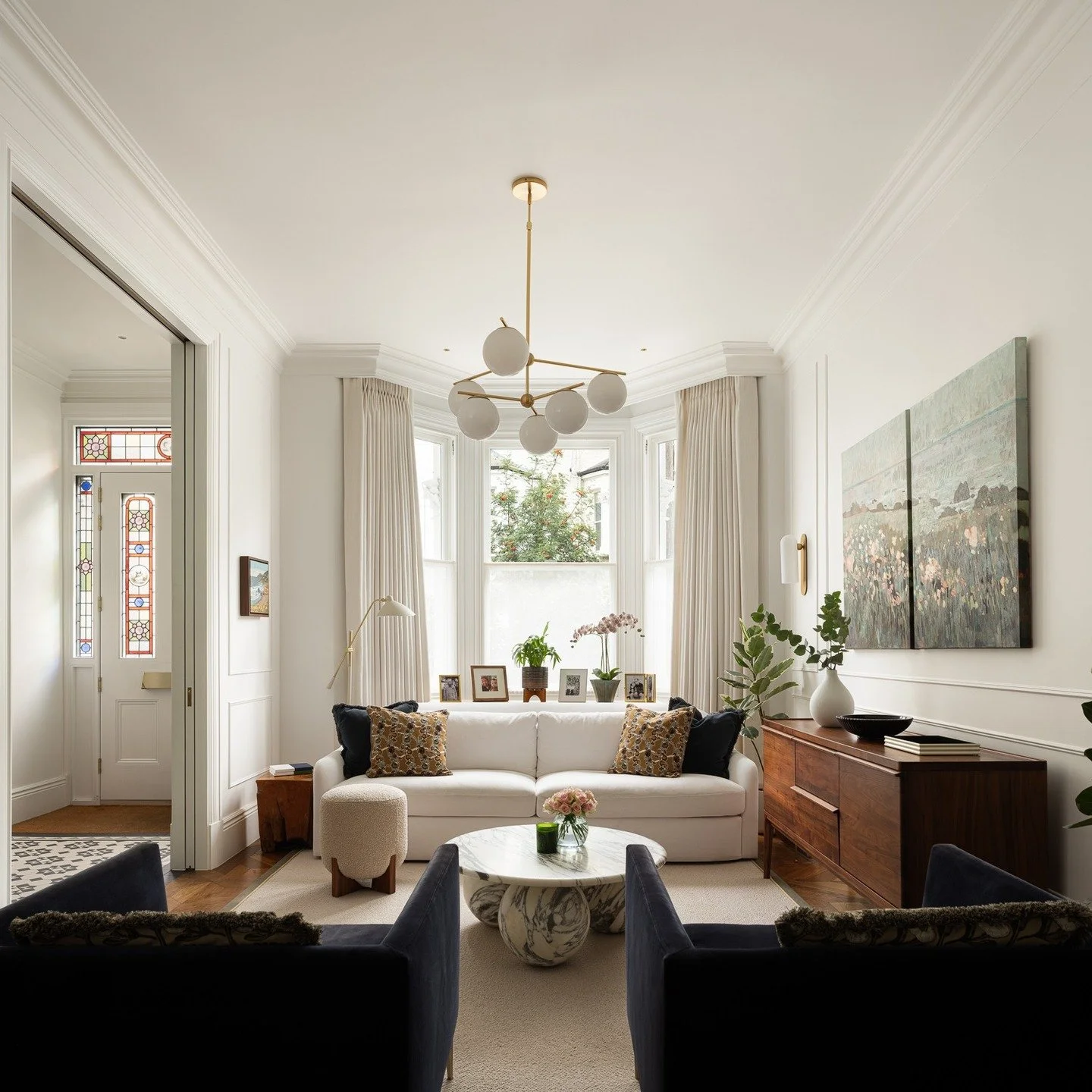 Parsons Green Home

From the seamless pocket doors to mouldings that frame both architecture and light, every detail has a purpose. Curtains are tucked behind panelling for a clean, tailored finish, while layered light sources &mdash; from the chande