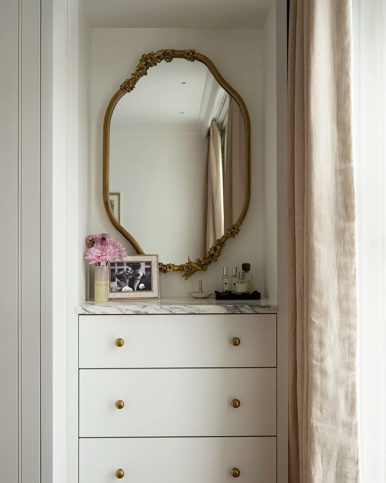 Parsons Green House

A thoughtfully designed built-in vanity that blends function with elegance &mdash; featuring a marble countertop, brass detailing, and a hidden outlet space for everyday essentials like a hairdryer or curler.

The vintage gold mi