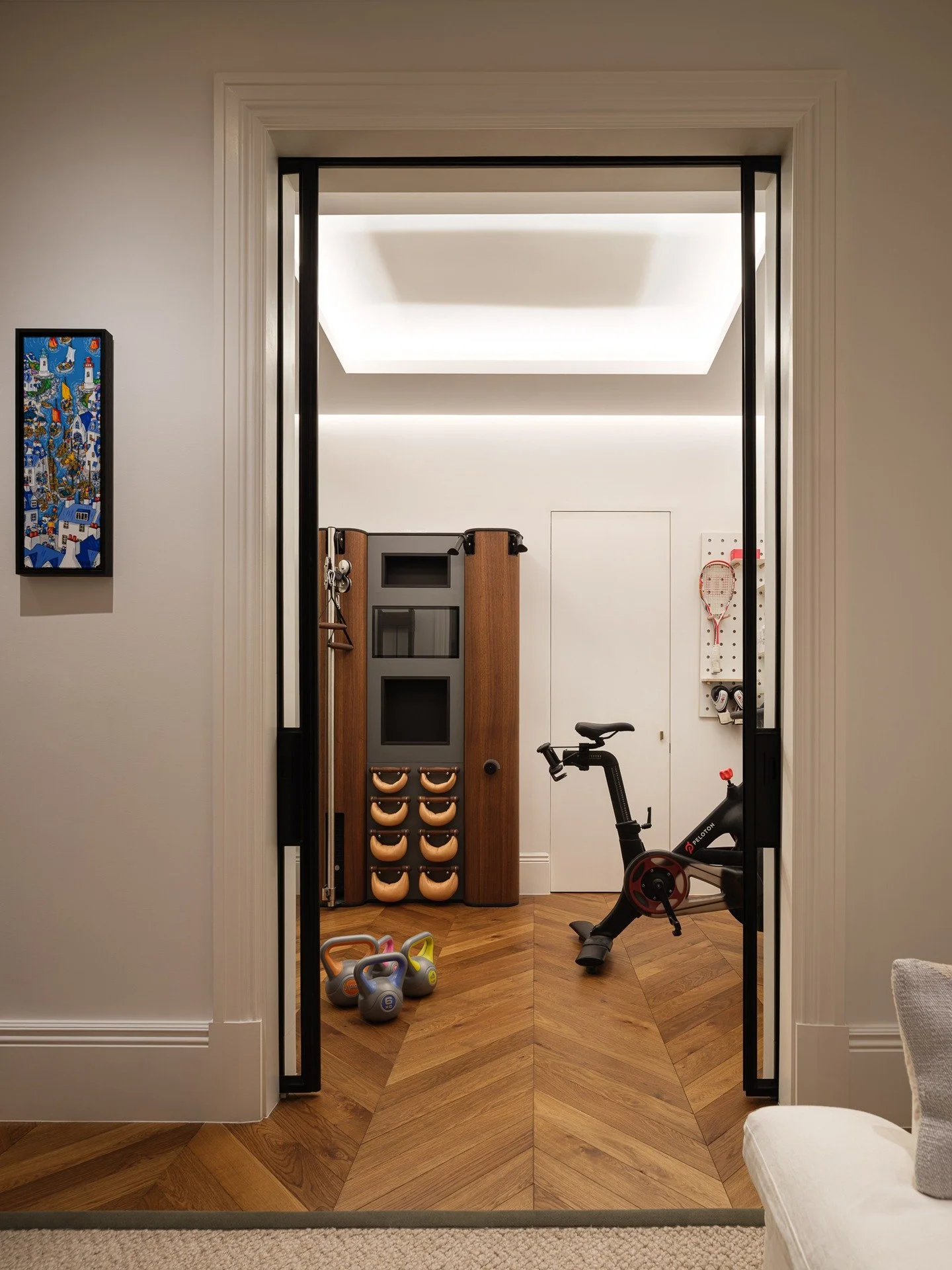 Parsons Green House

A home gym should energise, not compromise &mdash; a space where performance meets polish. This compact wellness corner was designed with the same consideration as the rest of the home: warm timber tones, layered lighting, and se