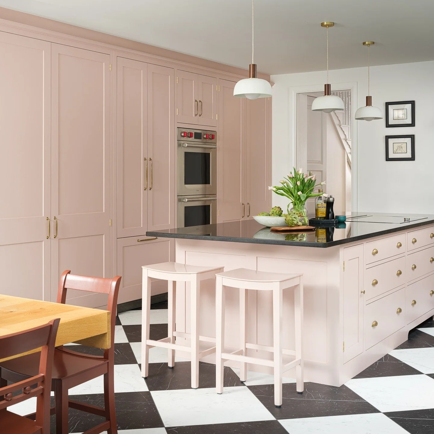 SW6 House

Soft colour, strong contrast, timeless intent.

A kitchen designed to work hard while feeling effortlessly elegant &mdash; bespoke blush cabinetry, glossy black stone, and a graphic checkerboard floor grounding the space. Layered lighting 