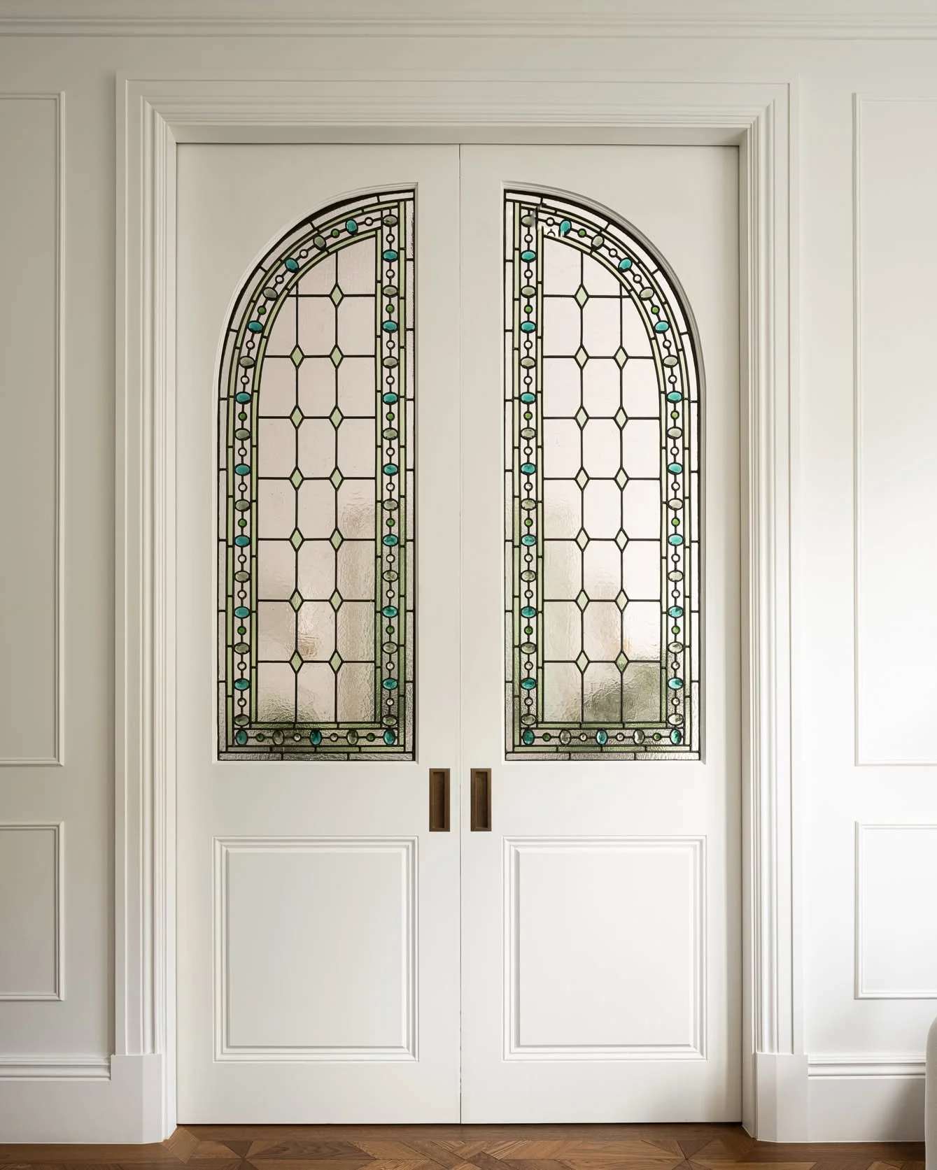 Parsons Green House | The Stained Glass Pocket Doors

These doors were designed by the studio to solve a specific problem: how to close off the reception from the hallway without losing the light that connects the two spaces.

Stained glass was the a