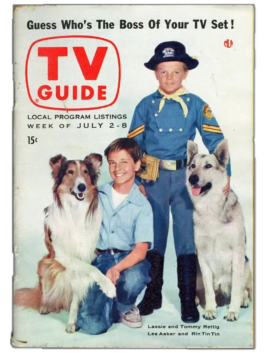A magazine cover. A collie sits beside a kneeling boy in a blue shirt; a second boy in cavalry uniform stands with a German shepherd. Headline: Guess Who's The Boss Of Your TV Set!