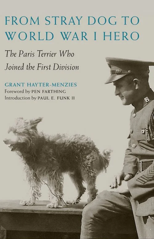 Book cover of From Stray Dog to World War I Hero by Grant Hayter-Menzies, showing a shaggy terrier standing beside a seated uniformed soldier.