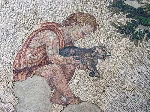 Ancient Roman mosaic showing a child gently holding a small dog, created with tiny colored tiles in intricate detail.